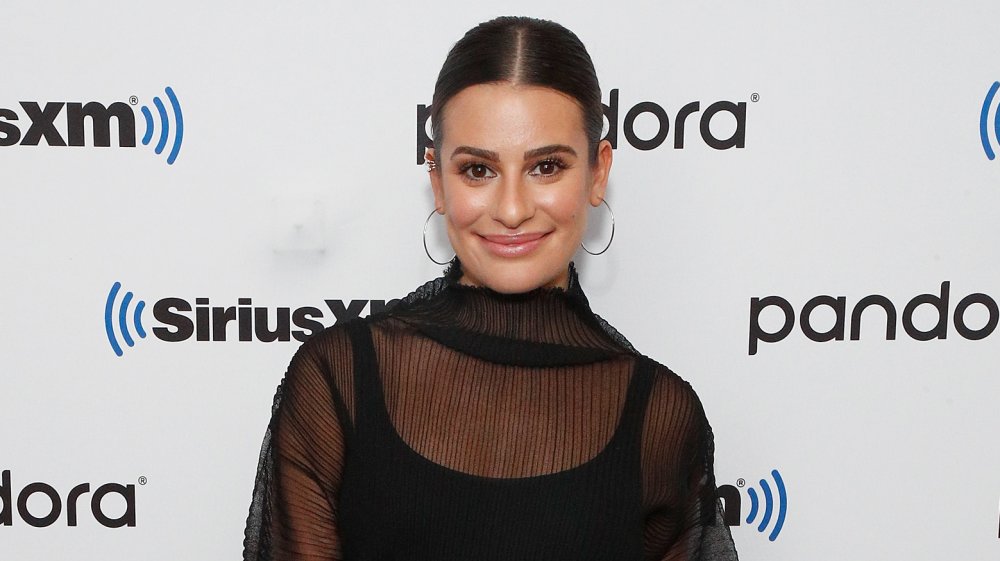 Lea Michele smiling, hair in low ponytail