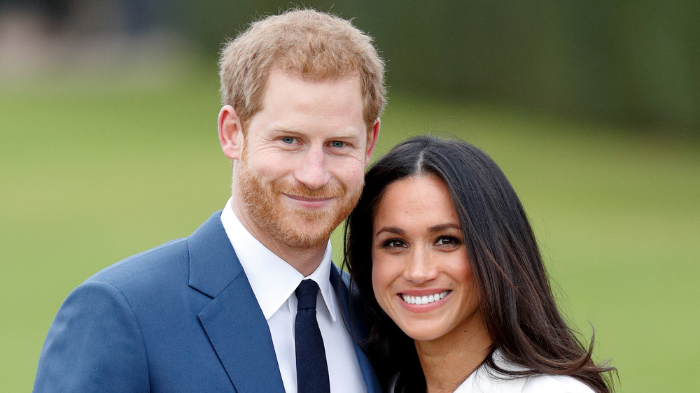 Prince Harry and Meghan Markle smiling