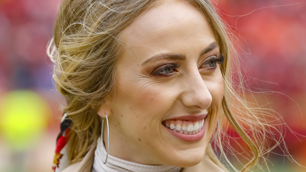 Brittany Matthews smiling on the sidelines