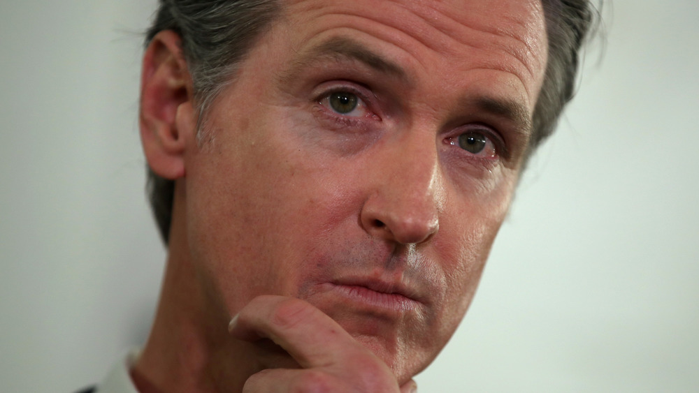 Gavin Newsom scratching his chin