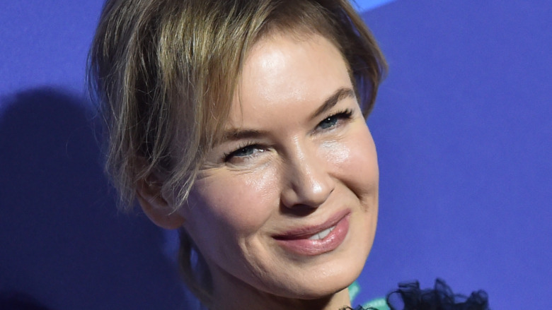 Renee Zellweger smiling with pink lipstick