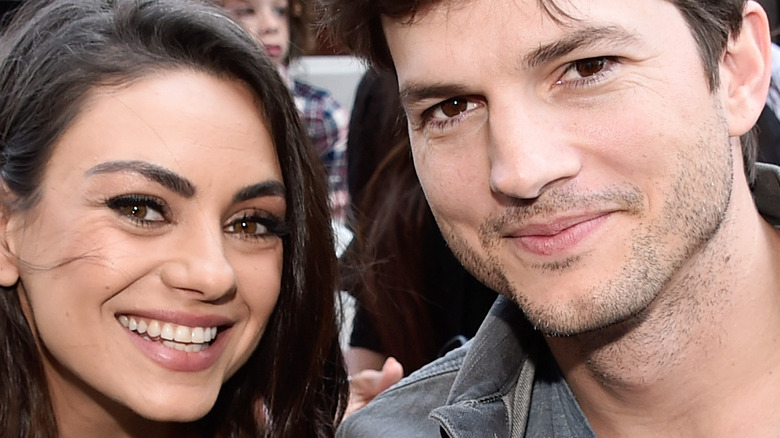 Mila Kunis and Ashton Kutcher smiling