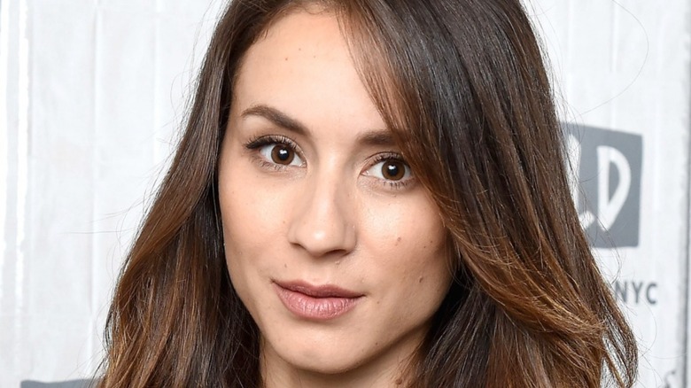 Troian Bellisario smiling