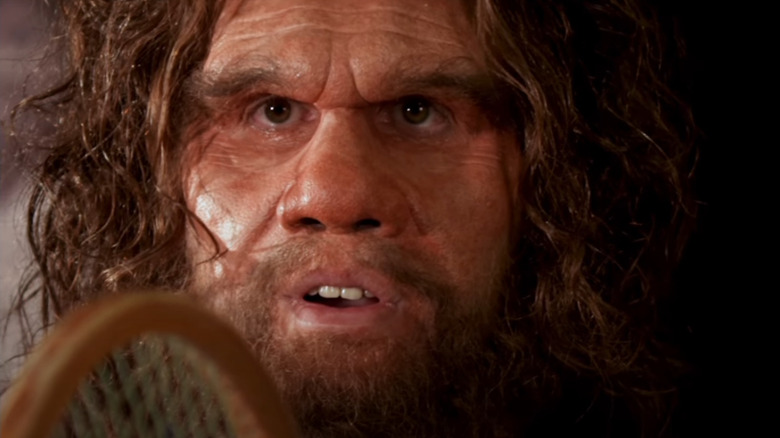 Geico Caveman with tennis racket