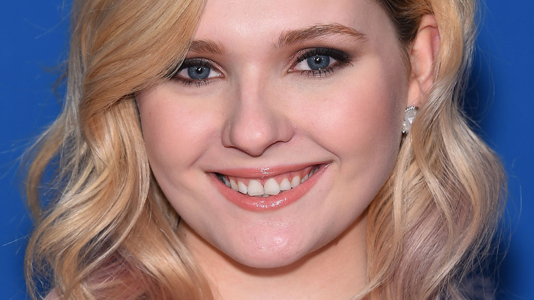 Abigail Breslin smiling with wavy hair