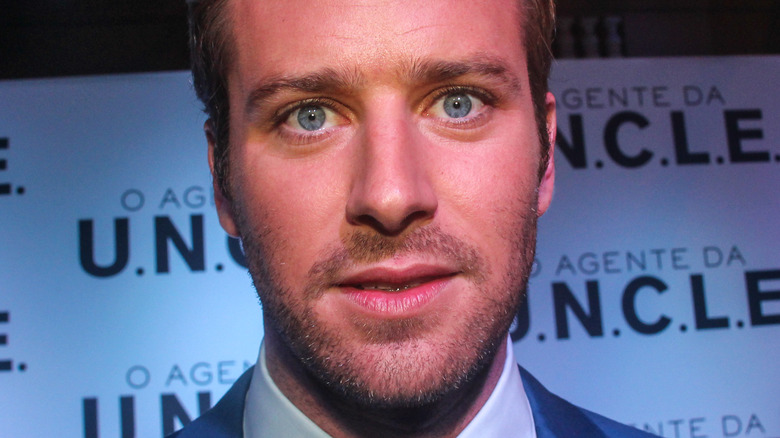 Armie Hammer posing, wide eyed