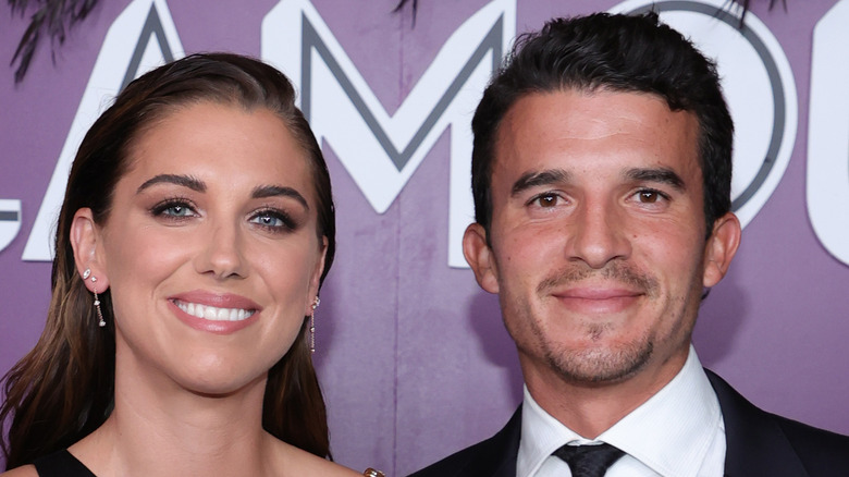 Alex Morgan and Servando Carrasco smiling