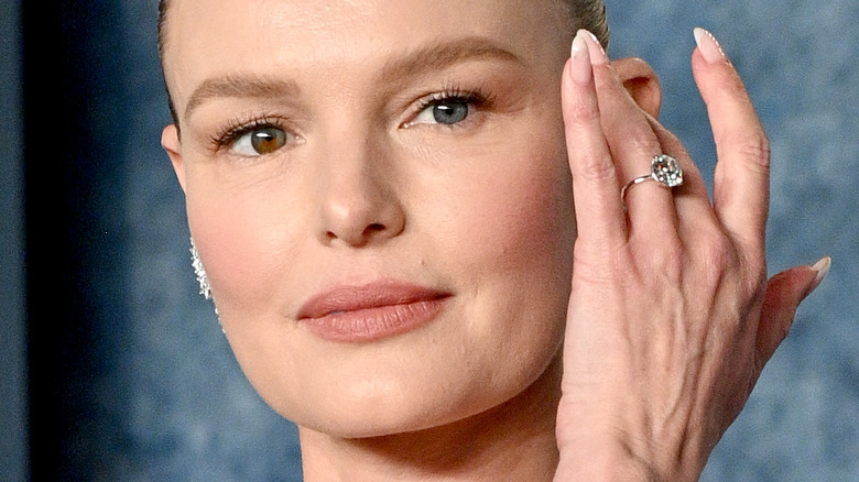 Kate Bosworth holding hand to face with diamond ring