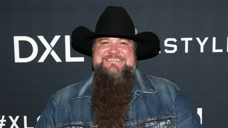 Sundance Head smiling in a cowboy hat