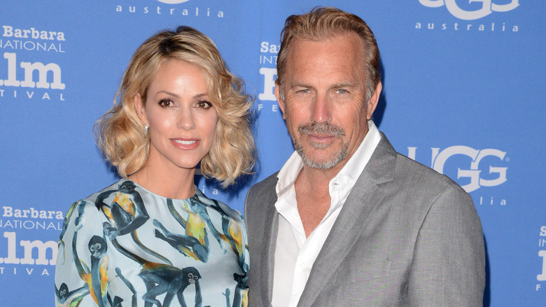 Kevin Costner and Christine Baumgartner posing