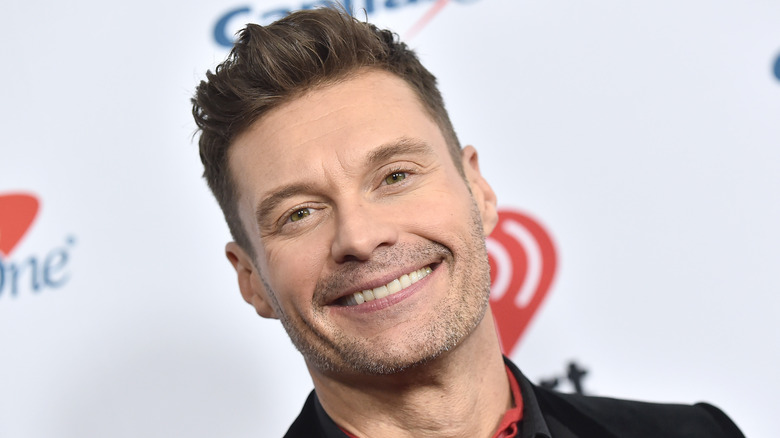 Ryan Seacrest smiling at camera