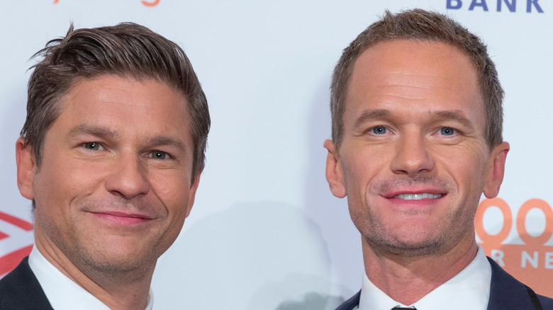 David Burtka and Neil Patrick Harris posing at an event