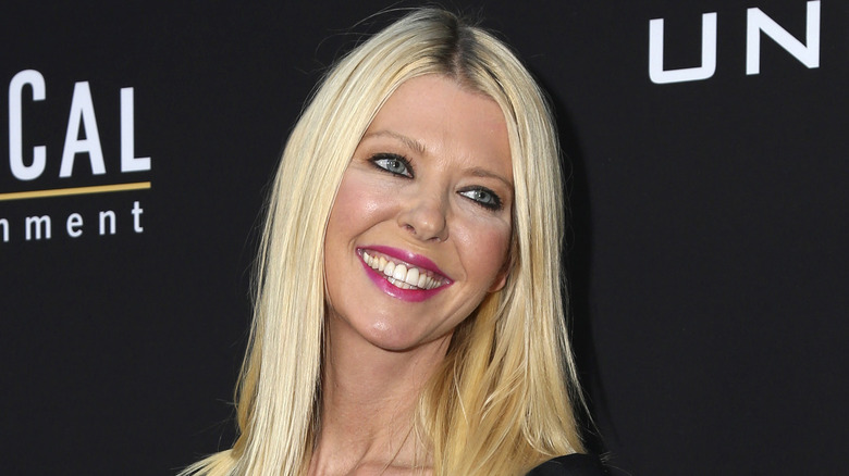 Tara Reid posing at an event