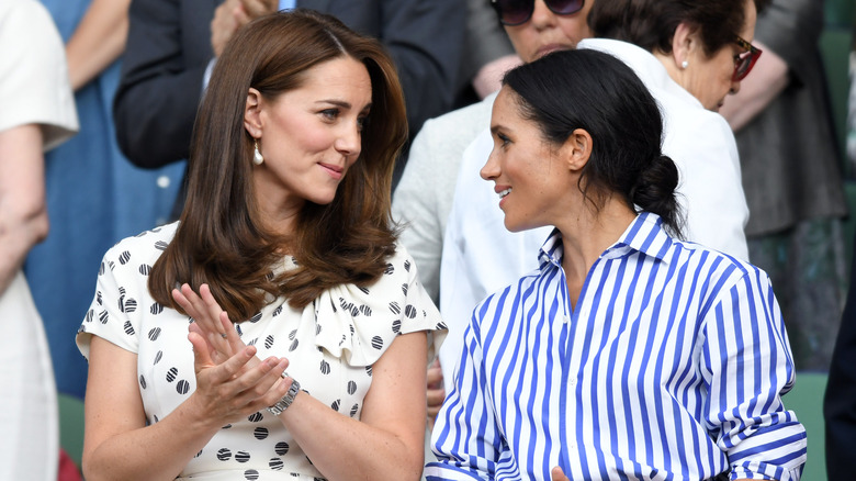 Kate Middleton and Meghan Markle talking