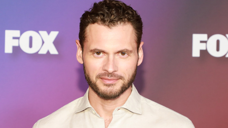 Adan Canto smirking