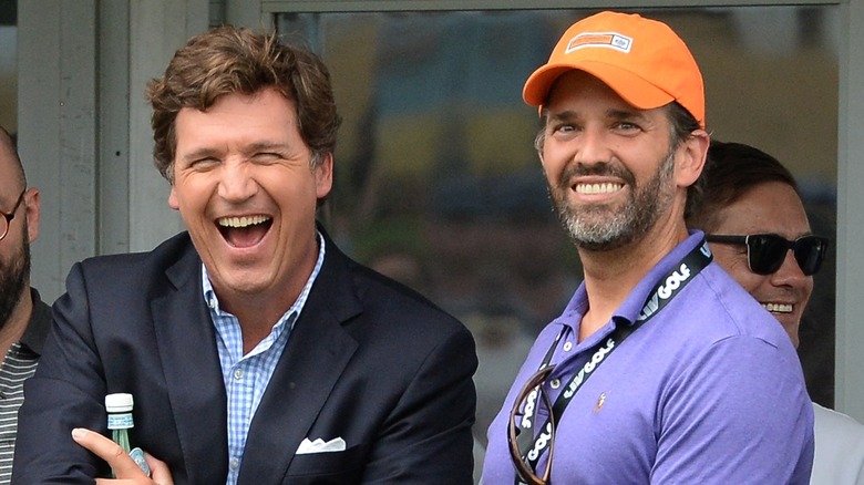 Donald Trump Jr. and Tucker Carlson laughing