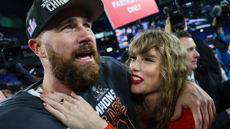 Travis Kelce hugging Taylor Swift