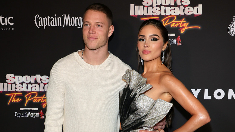 Christian McCaffrey, Olivia Culpo posing