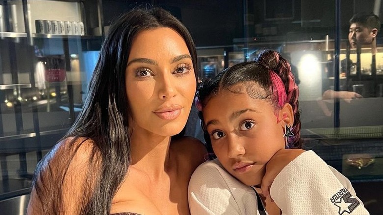 Kim Kardashian poses with North West