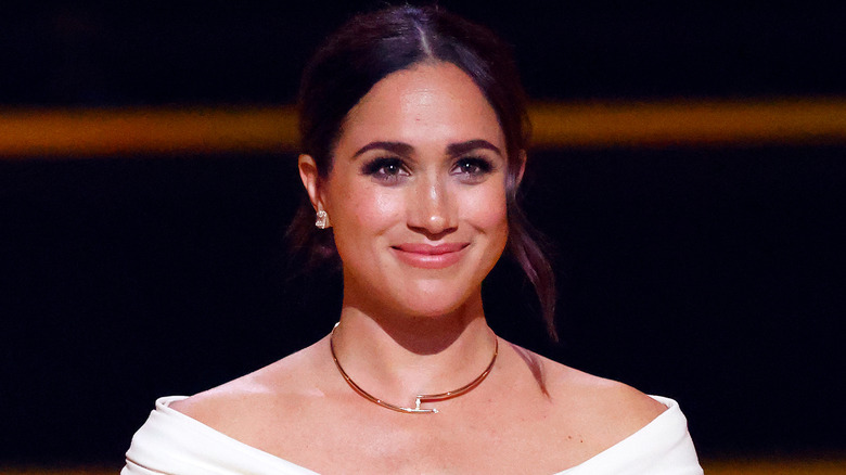 Meghan Markle white dress smiling